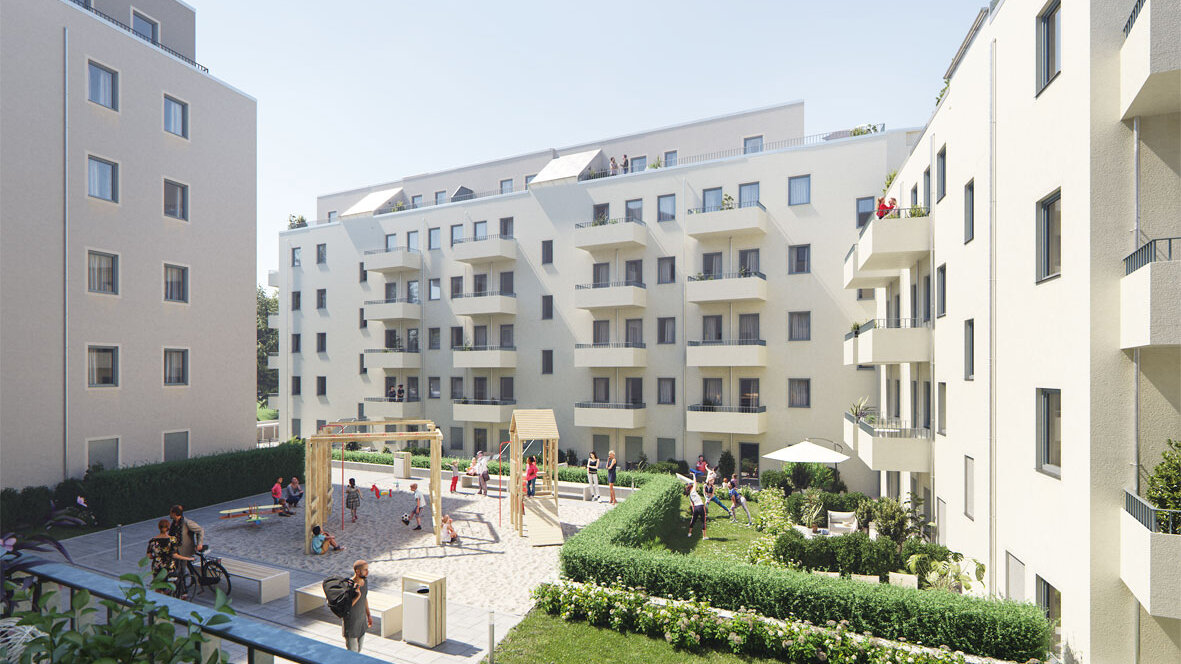 Innenhofansicht mit Spielplatz, Sitzbereichen und Grünflächen. Mehrgeschossige Wohngebäude mit Balkonen rahmen den gemeinschaftlich genutzten Freiraum.