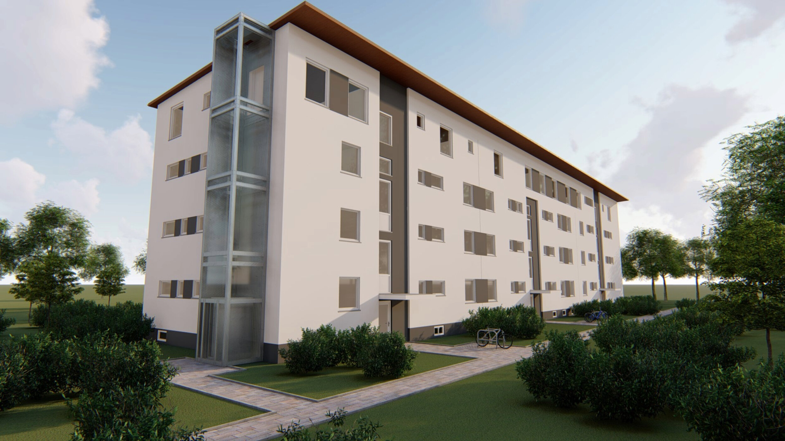 Visualisierung eines viergeschossigen Mehrfamilienhauses mit heller Putzfassade und dunklem Fassadenakzent. An der Stirnseite befindet sich ein verglaster Aufzugsschacht. Das Gebäude ist von Grünflächen, Sträuchern und Bäumen umgeben, gepflasterte Wege führen zu den Eingängen. Fahrradstellplätze sind im Außenbereich angeordnet.