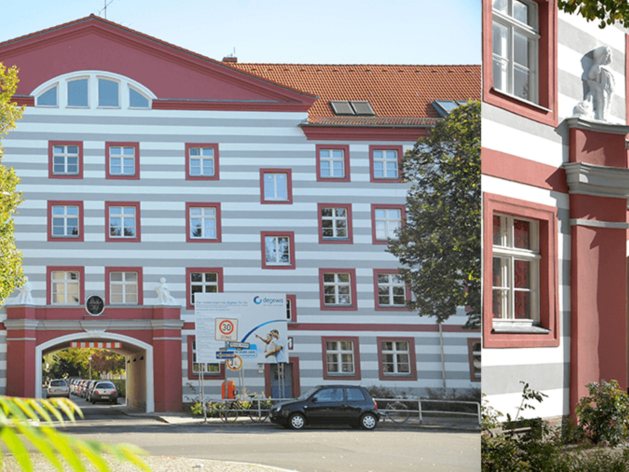 Denkmalgeschütztes Gebäude in der Aroser Allee 40 mit rotem Dach und roten Fensterrahmen.